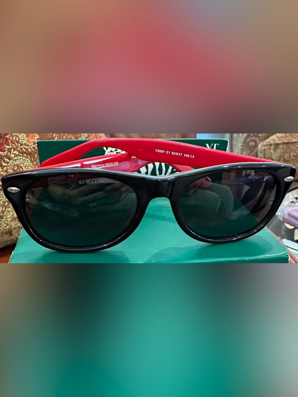 Versace Black Frame Sunglasses with Red Temples and Dark Lenses